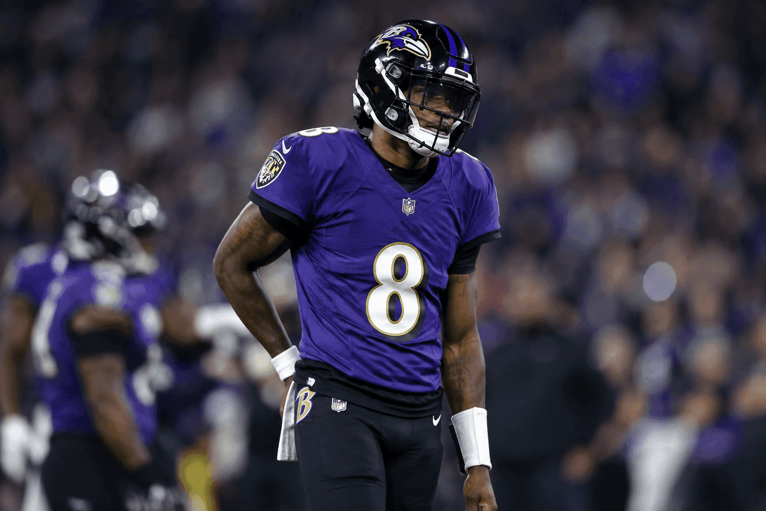 Editorial sports image for Lamar Jackson Limited With Back Injury Following Shootout Win Over Cowboys