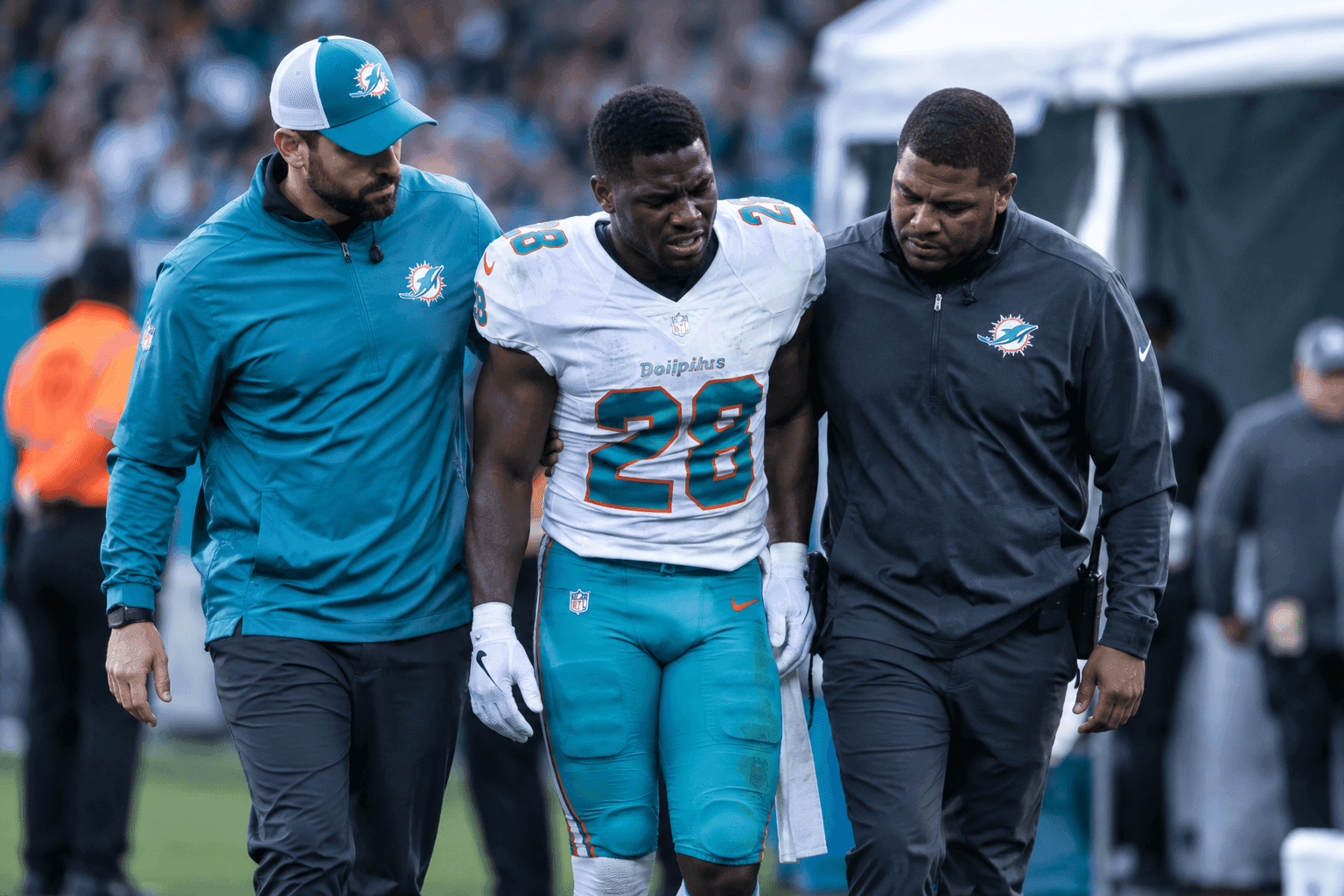 Editorial sports image for De'Von Achane Suffers Knee Injury as Dolphins Backfield Depth Evaporates