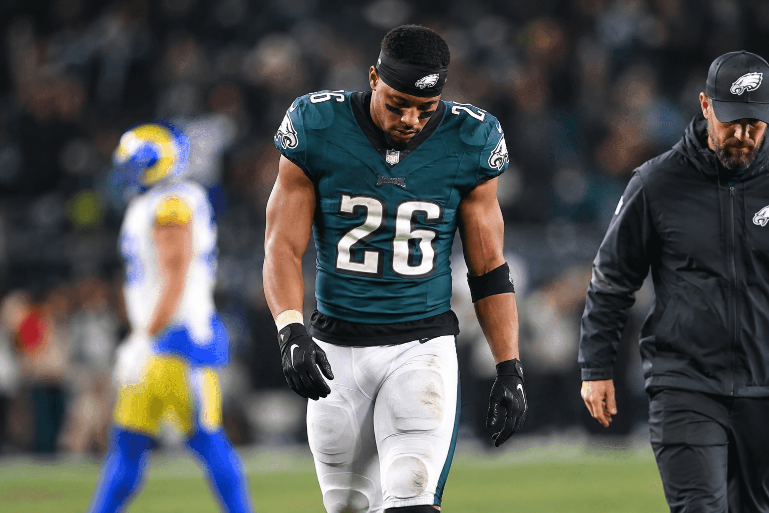 Editorial sports image for Saquon Barkley Heads to Locker Room with Hamstring Injury Against Rams