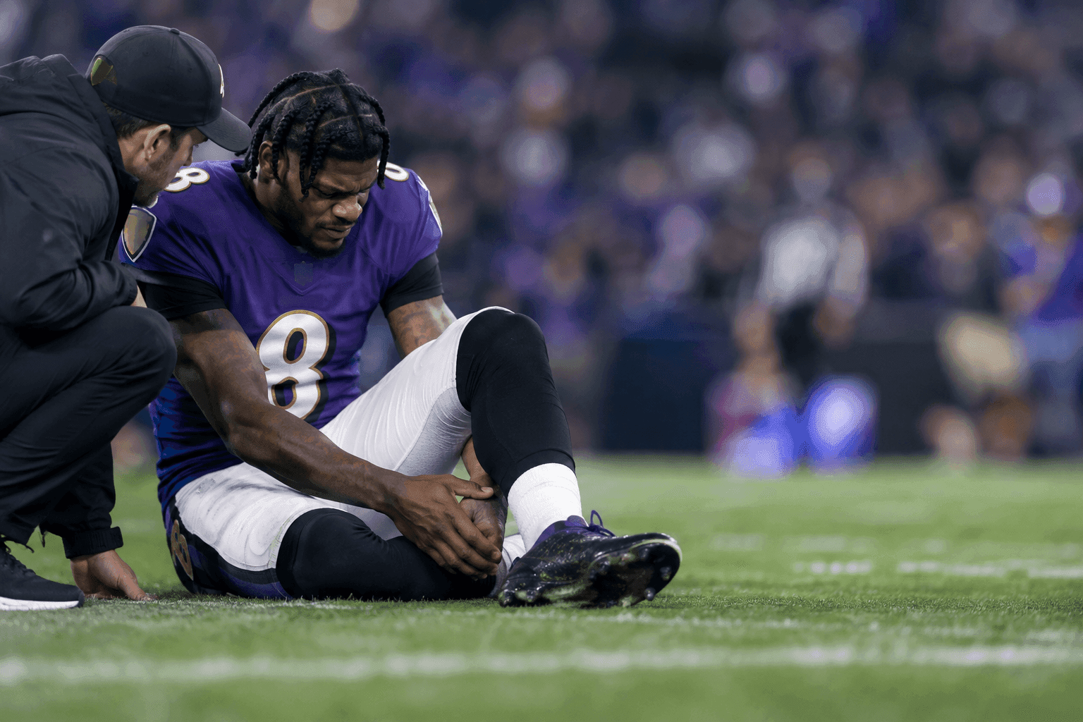 Editorial sports image for Lamar Jackson's Sprained Ankle Leaves Ravens Scrambling Ahead of Falcons Matchup