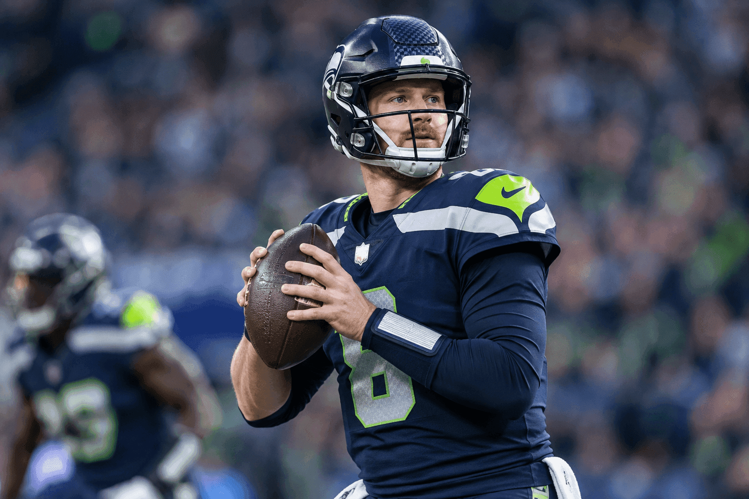 Editorial sports image for Sam Darnold Dodges a Bullet: Seahawks QB Clears Initial Scans After Injury Scare