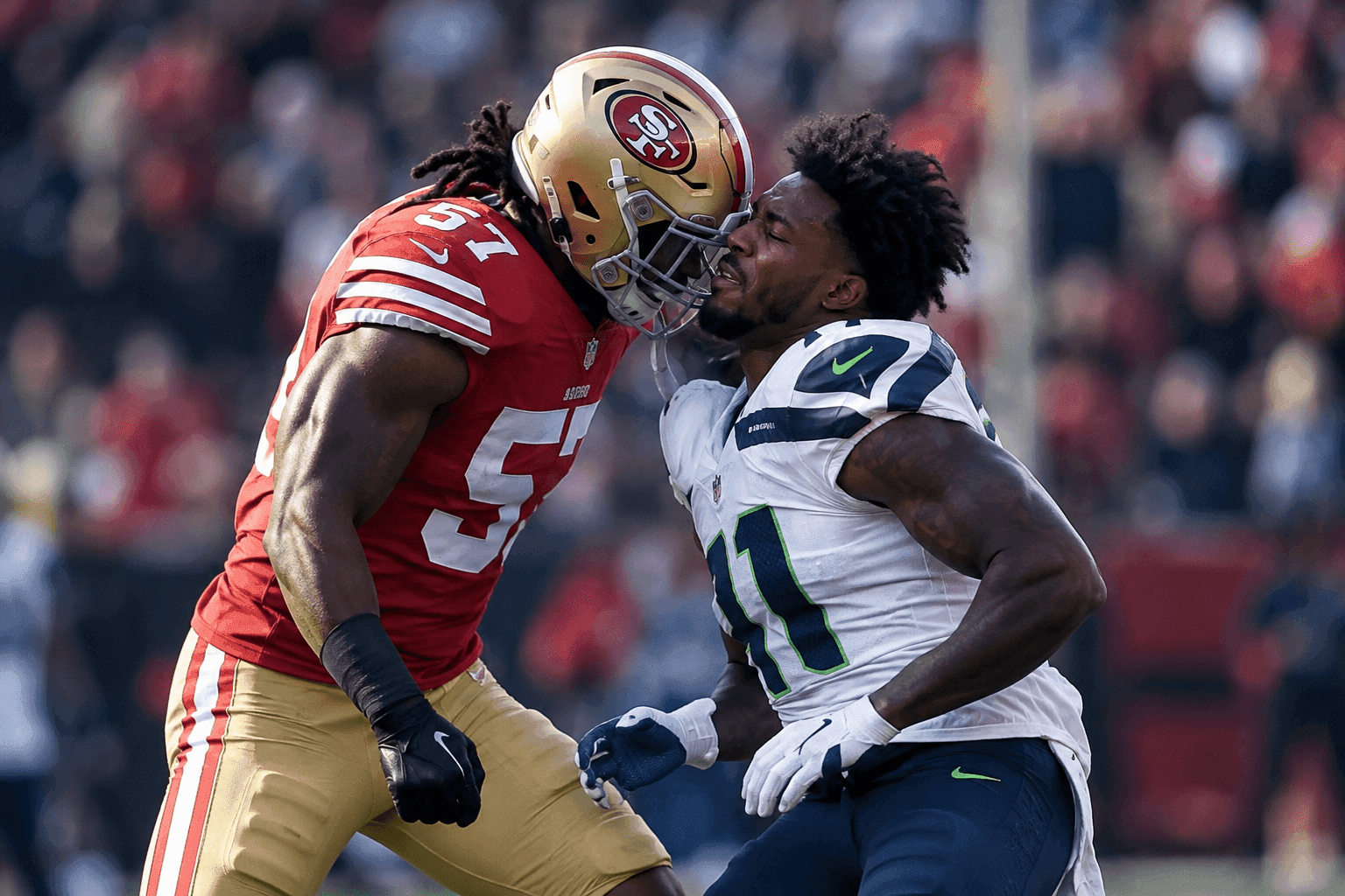 Editorial sports image for Dre Greenlaw Suspended One Game for Headbutting Helmetless Ernest Jones IV