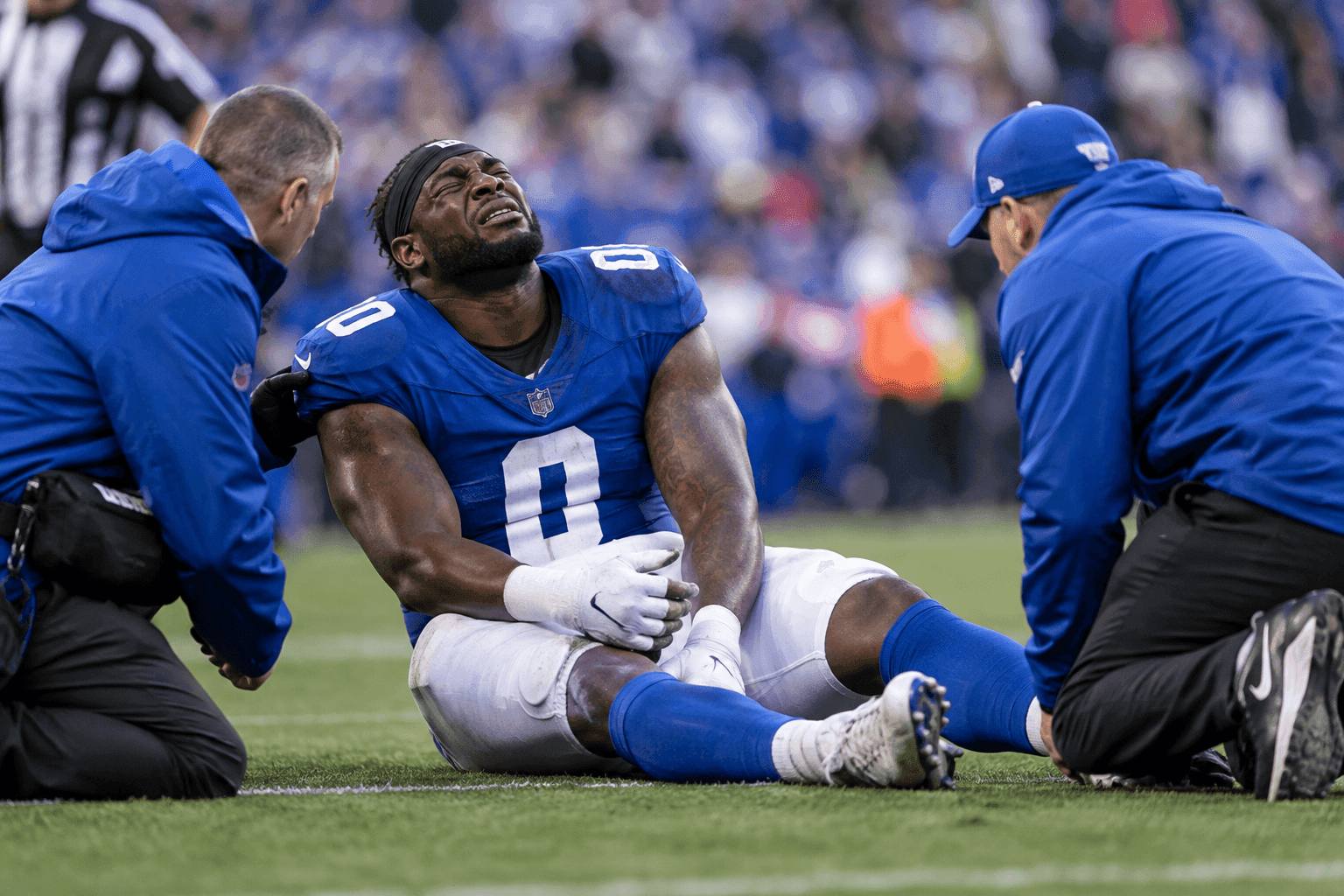Editorial sports image for Giants Edge Rusher Brian Burns Suffers Devastating ACL Tear After Playing Through Ankle Injury