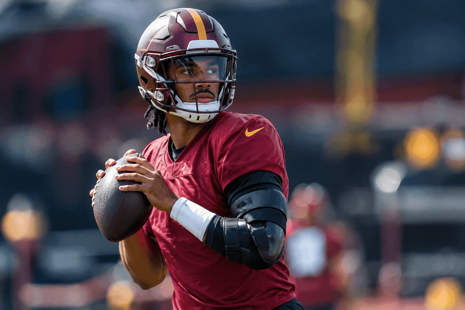 Editorial sports image for Jayden Daniels Returns to Practice in a Brace as Commanders Eye Giants Matchup