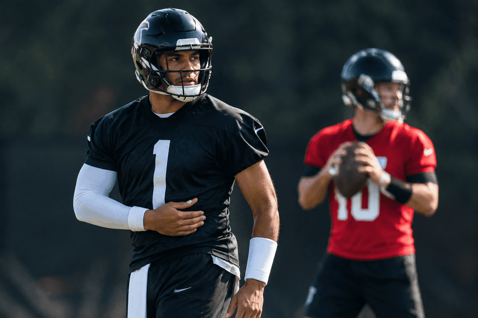 Editorial sports image for Tua Tagovailoa Suffers Oblique Injury, Cooper Rush Takes Falcons QB1 Reps