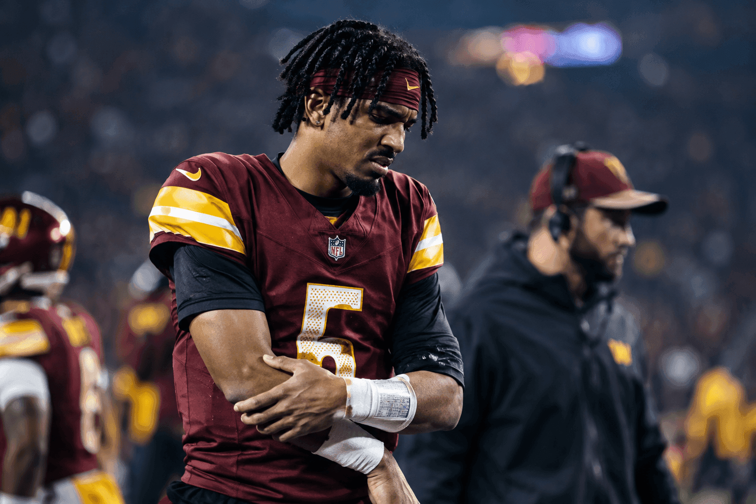 Editorial sports image for Jayden Daniels Dislocates Elbow Again, Forcing Commanders to Ride the Marcus Mariota Rollercoaster